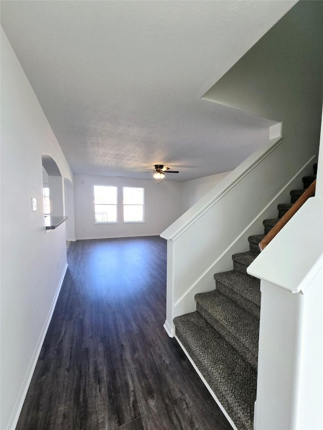 interior space with ceiling fan, hardwood / wood-style floors, and a textured ceiling