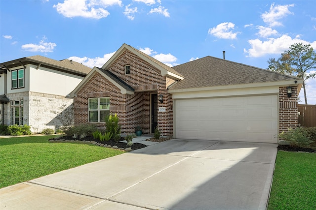 view of front of property with a front yard and a garage