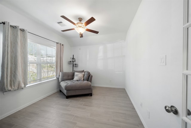 sitting room featuring ceiling fan and light hardwood / wood-style flooring