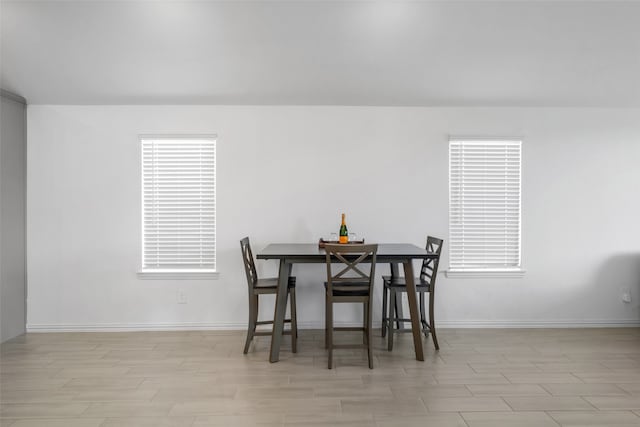 dining space with light hardwood / wood-style flooring