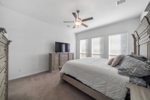 bedroom featuring ceiling fan and light carpet