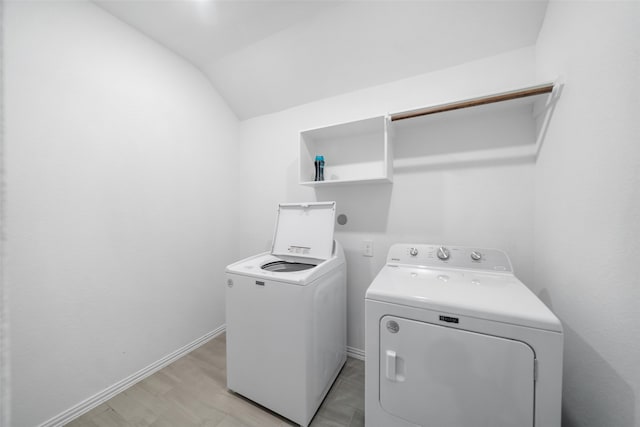 washroom featuring washer and clothes dryer