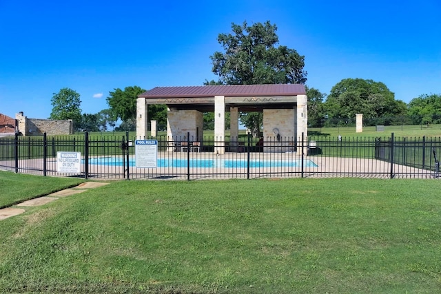 view of pool with a yard and a patio