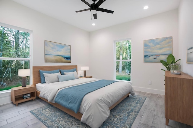 bedroom featuring ceiling fan and light hardwood / wood-style flooring