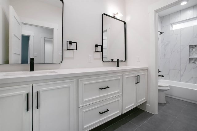 full bathroom featuring toilet, tile patterned flooring, tiled shower / bath combo, and vanity