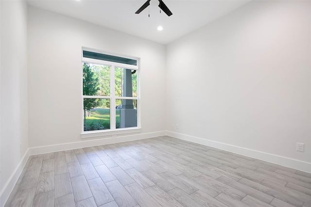 unfurnished room featuring ceiling fan and light hardwood / wood-style floors