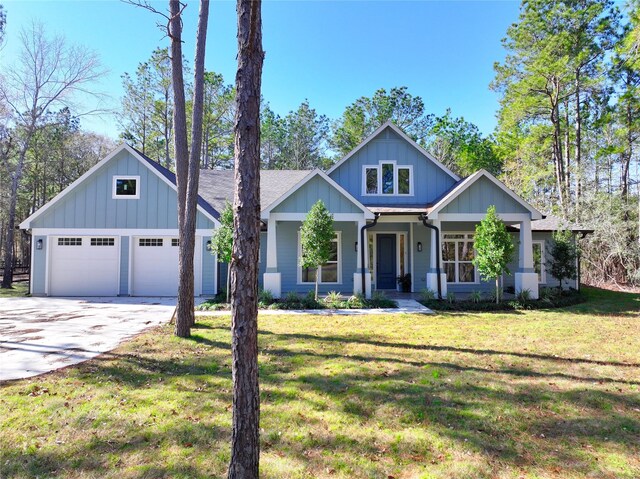 view of front of home featuring a garage and a front lawn