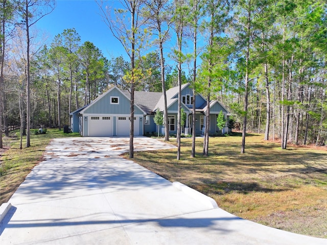 view of front of home featuring a garage and a front lawn