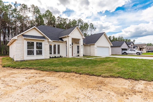 view of front facade with a garage and a front yard