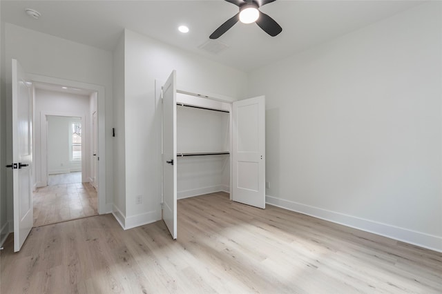 unfurnished bedroom with a closet, ceiling fan, and light hardwood / wood-style flooring