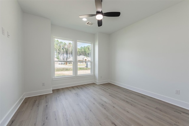 spare room with ceiling fan and light hardwood / wood-style floors