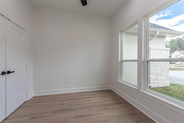 unfurnished room with light wood-type flooring