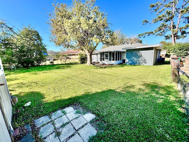 view of yard featuring a sunroom