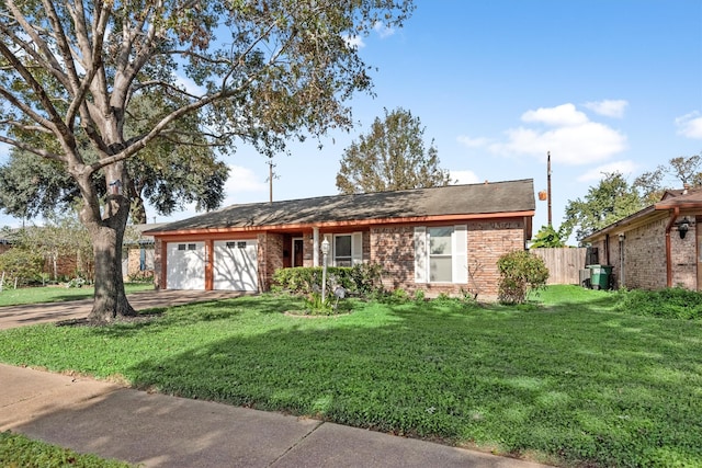 view of front facade with a garage and a front yard