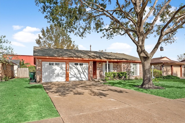 single story home featuring a front yard and a garage