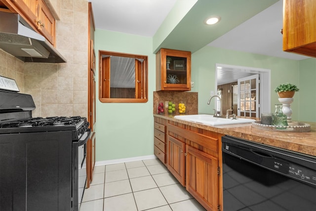 kitchen with light tile patterned flooring, sink, decorative backsplash, black dishwasher, and gas stove