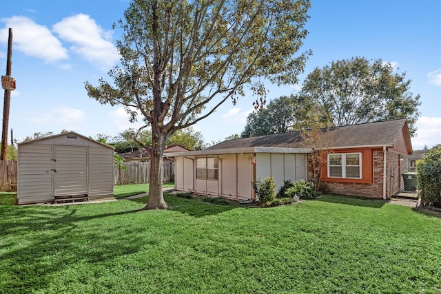 exterior space featuring a yard and a storage shed