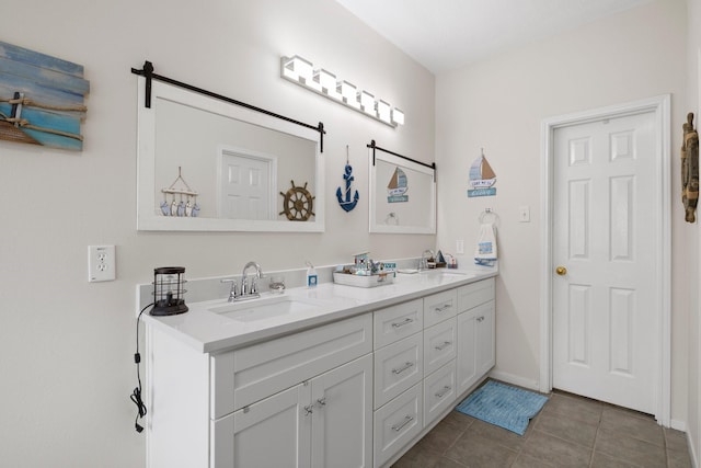 bathroom with tile patterned floors and vanity