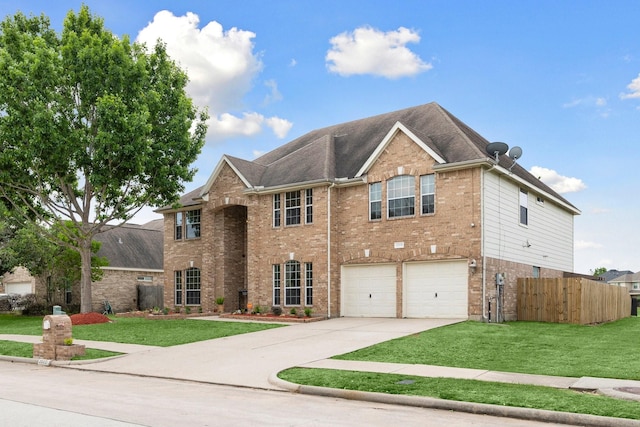 view of front of property featuring a front yard and a garage