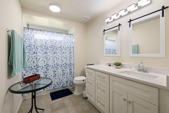 bathroom with vanity, toilet, and walk in shower