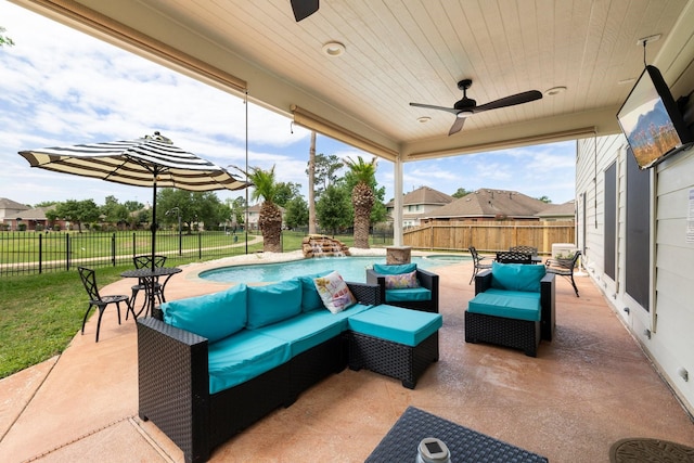 view of patio / terrace featuring a fenced in pool, outdoor lounge area, and ceiling fan