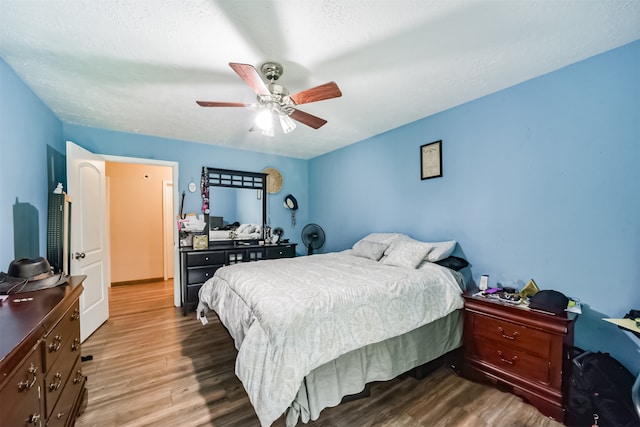 bedroom featuring ceiling fan and wood-type flooring