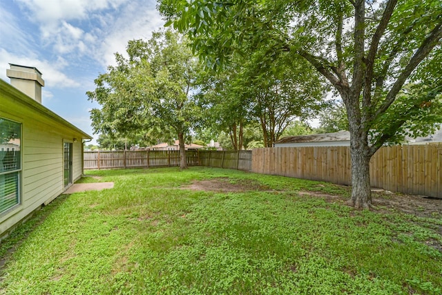 view of yard featuring a fenced backyard