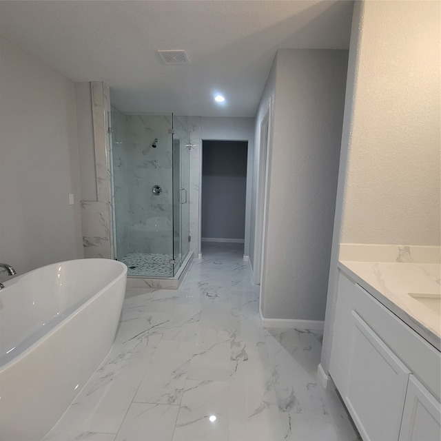 bathroom featuring vanity and shower with separate bathtub