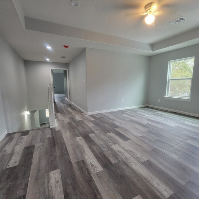 unfurnished room featuring ceiling fan and hardwood / wood-style floors