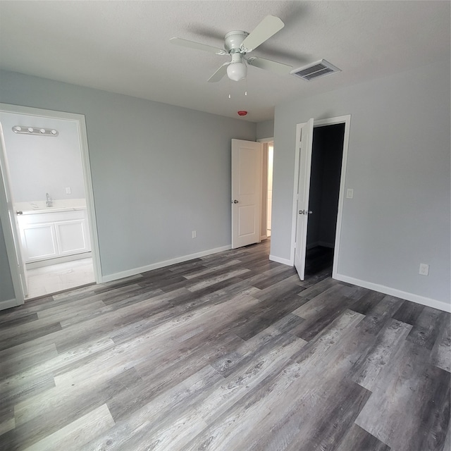 interior space featuring hardwood / wood-style floors and ceiling fan