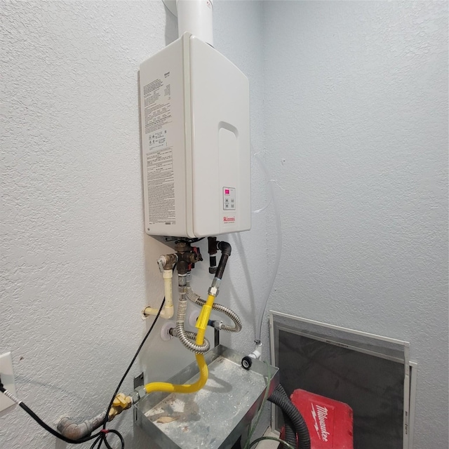 6232 Nuben St, Houston, TX 77091 - detailed view of a textured wall and tankless water heater