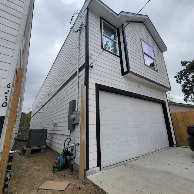 view of side of home featuring a garage