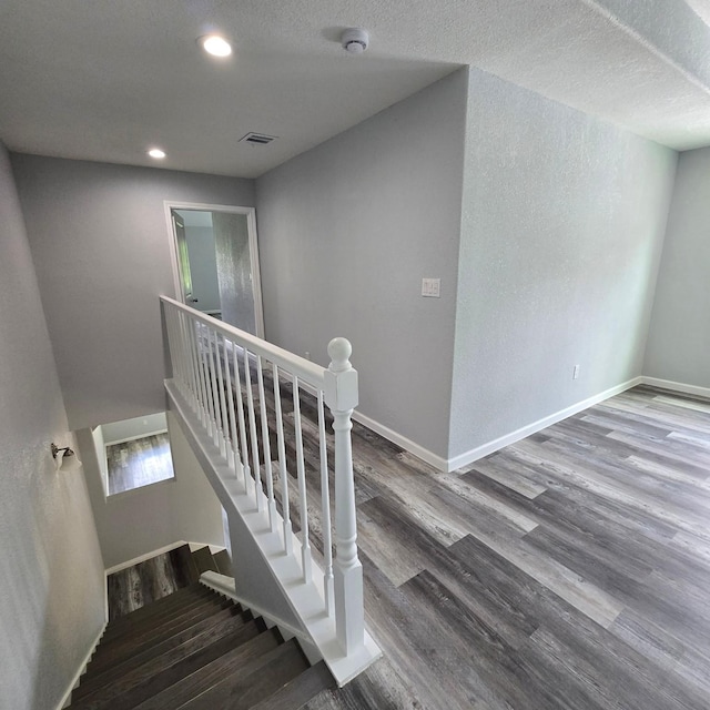 6232 Nuben St, Houston, TX 77091 - stairway featuring wood finished floors and recessed lighting