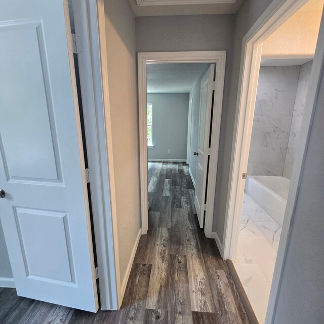 6232 Nuben St, Houston, TX 77091 - corridor featuring baseboards and dark wood-type flooring