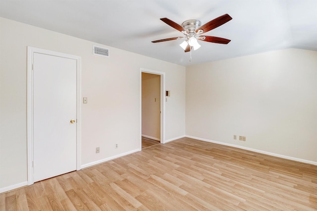 empty room with light hardwood / wood-style floors and ceiling fan