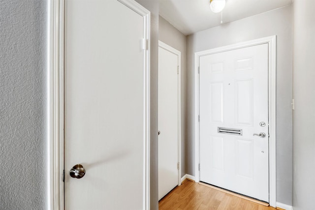 doorway to outside with light hardwood / wood-style floors