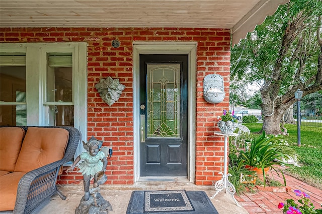 614 Clear Lake Rd, Kemah, TX 77565 - view of exterior entry with brick siding and covered porch