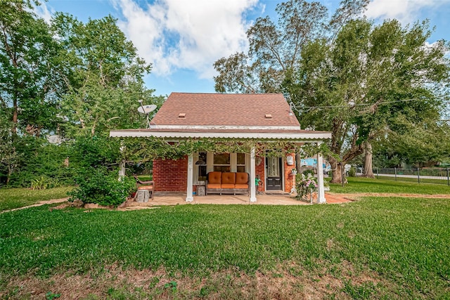 exterior space with a lawn and a patio