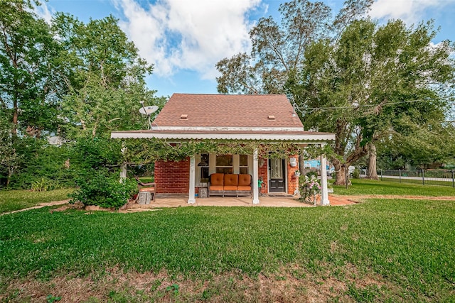 614 Clear Lake Rd, Kemah, TX 77565 - back of house featuring a patio and a shingled roof