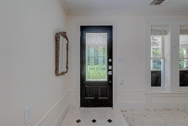 entrance foyer featuring crown molding