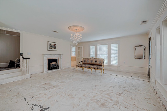 614 Clear Lake Rd, Kemah, TX 77565 - living area with ornamental molding, a chandelier, a premium fireplace, and baseboards