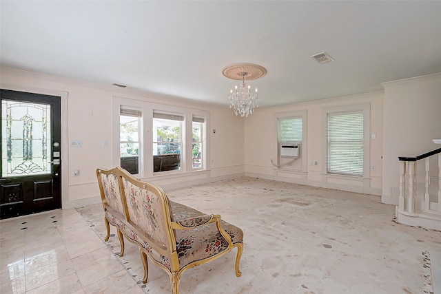 entryway featuring crown molding, a chandelier, and cooling unit