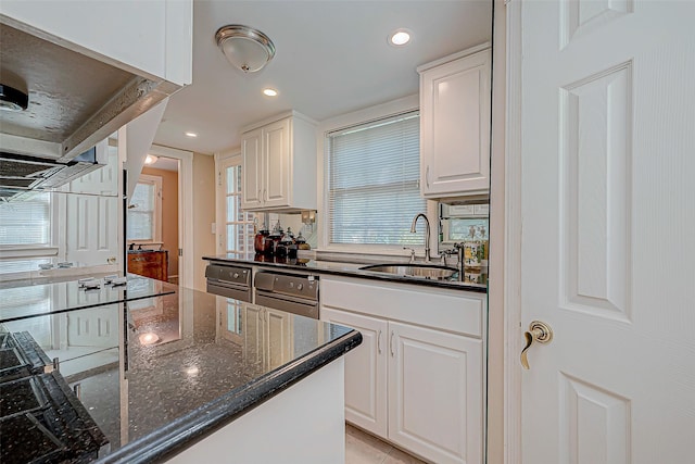 614 Clear Lake Rd, Kemah, TX 77565 - kitchen with a sink, white cabinets, dark stone countertops, and recessed lighting