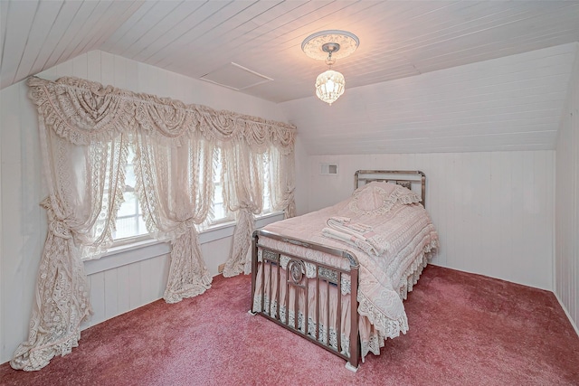 bedroom featuring carpet floors and vaulted ceiling