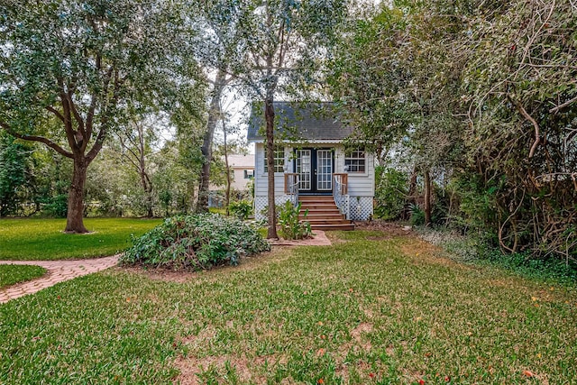 614 Clear Lake Rd, Kemah, TX 77565 - view of front of house featuring a front lawn