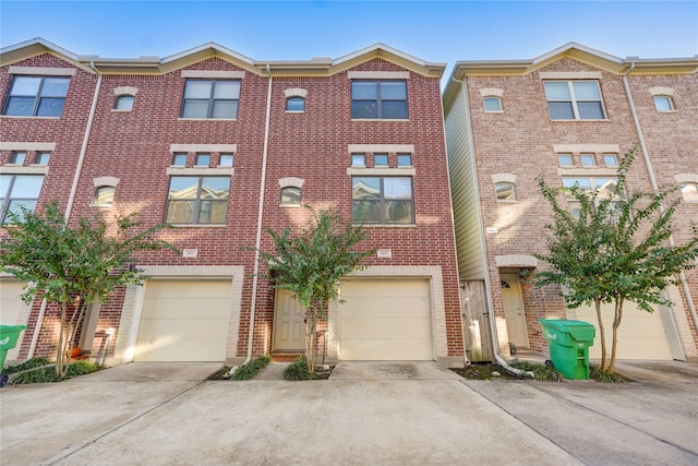 multi unit property featuring a garage