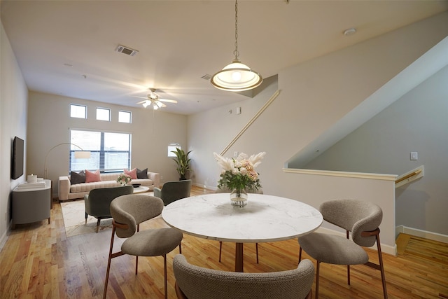 dining room featuring ceiling fan and light hardwood / wood-style floors