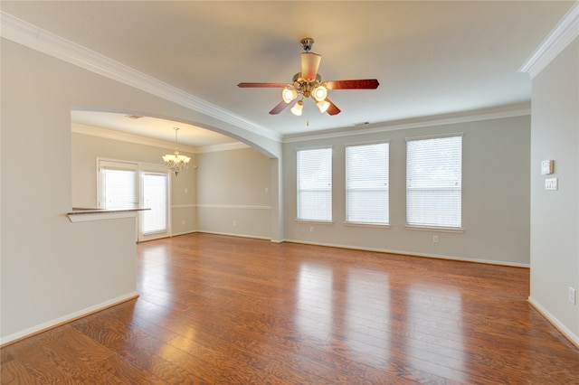 empty room with hardwood / wood-style floors, ceiling fan with notable chandelier, and ornamental molding