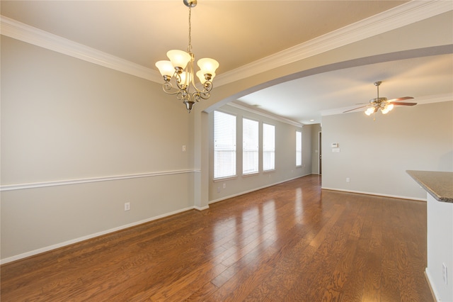 unfurnished living room featuring ceiling fan with notable chandelier, dark hardwood / wood-style flooring, and crown molding