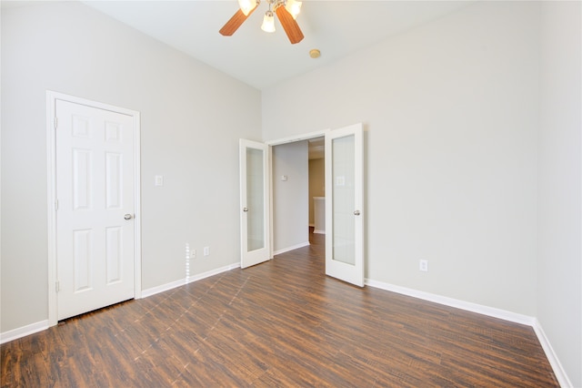 unfurnished room featuring french doors, dark hardwood / wood-style floors, and ceiling fan